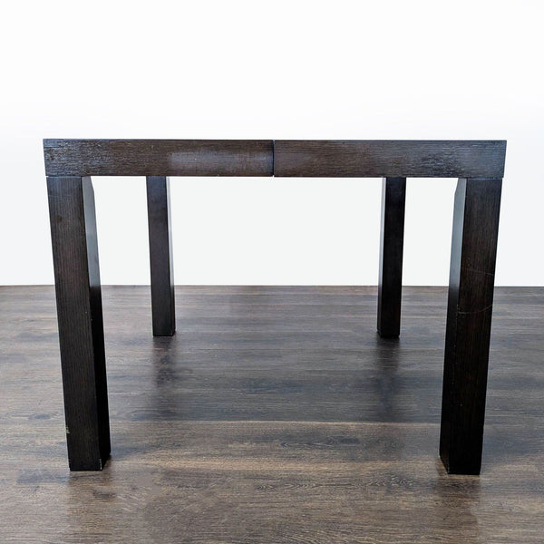 West Elm Parsons-style dining table with two extension leaves, modern and rectangular.