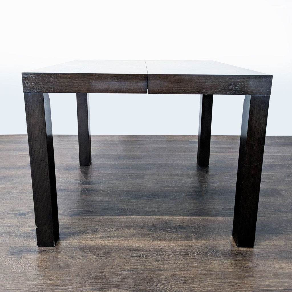 Rectangular Parsons dining table by West Elm, expandable with two leaves, ideal for dining rooms.