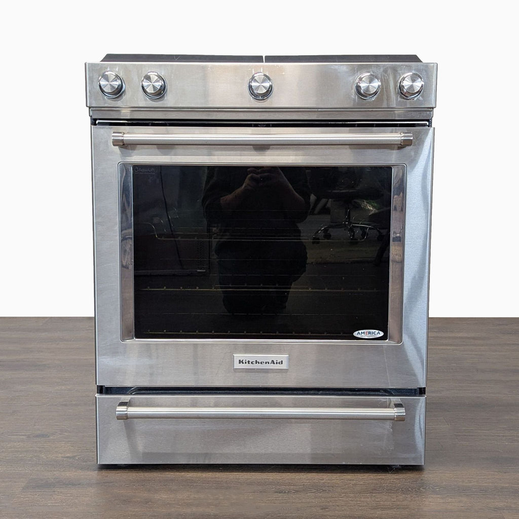 Modern KitchenAid stove & oven features spacious interior, five burners, and user-friendly controls.  