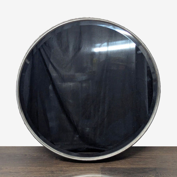 1. Round Uttermost mirror with a beveled edge and deep hammered metal frame in burnished gray with silver tones.