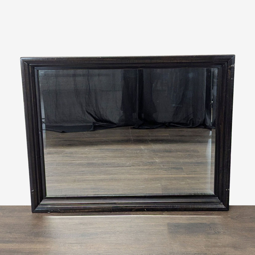 1. Rectangular mirror with a simple modern frame from Ashley Furniture, suitable for contemporary interiors.  
