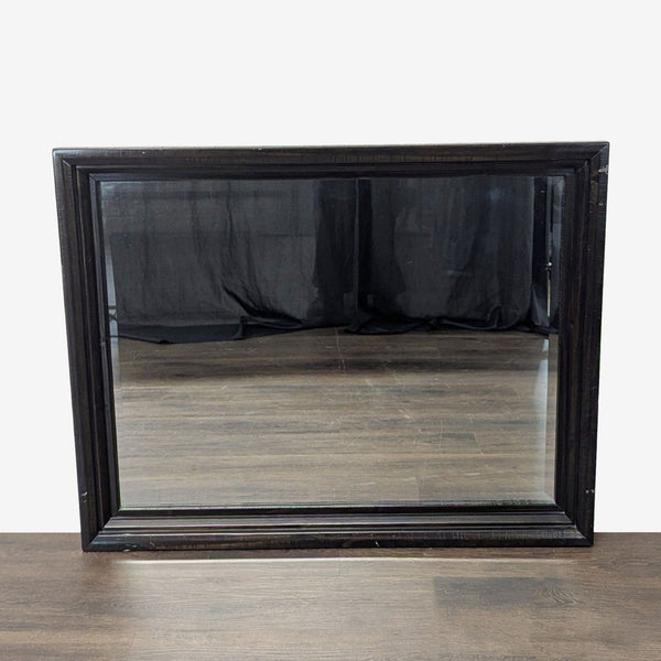 1. Rectangular mirror with a simple modern frame from Ashley Furniture, suitable for contemporary interiors.  