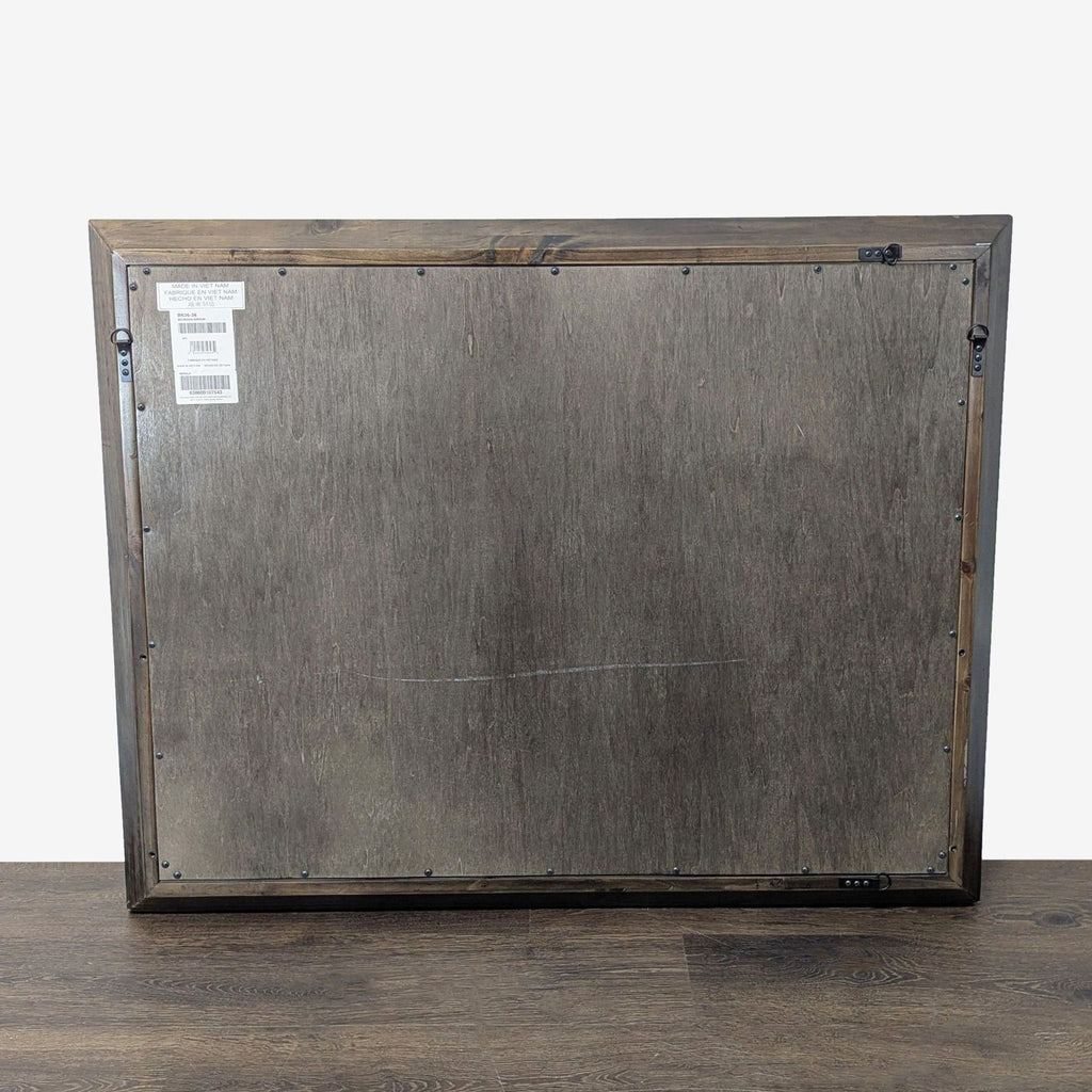 3. Minimalist mirror by Ashley Furniture, ideal for use in any room as both a functional and decorative piece.
