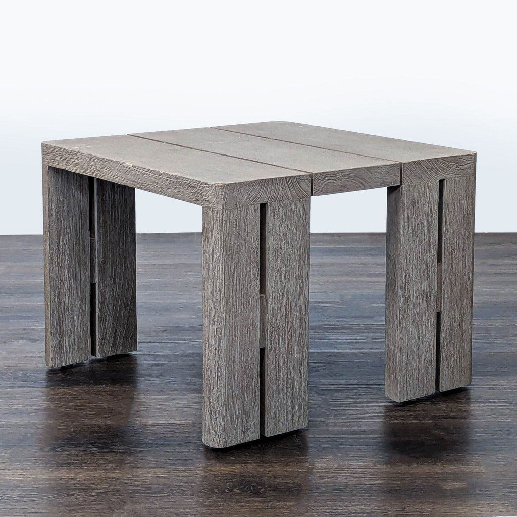 Restoration Hardware accent table featuring clean lines, solid legs, and a rustic teak look, angled side view.