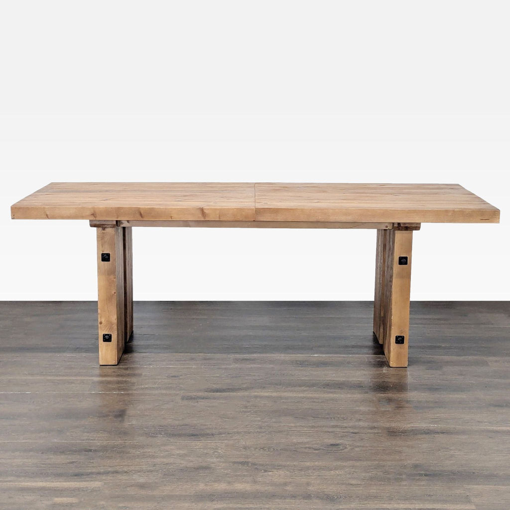 Pottery Barn recycled wood dining table with metal hardware, shown fully extended to seat eight people.