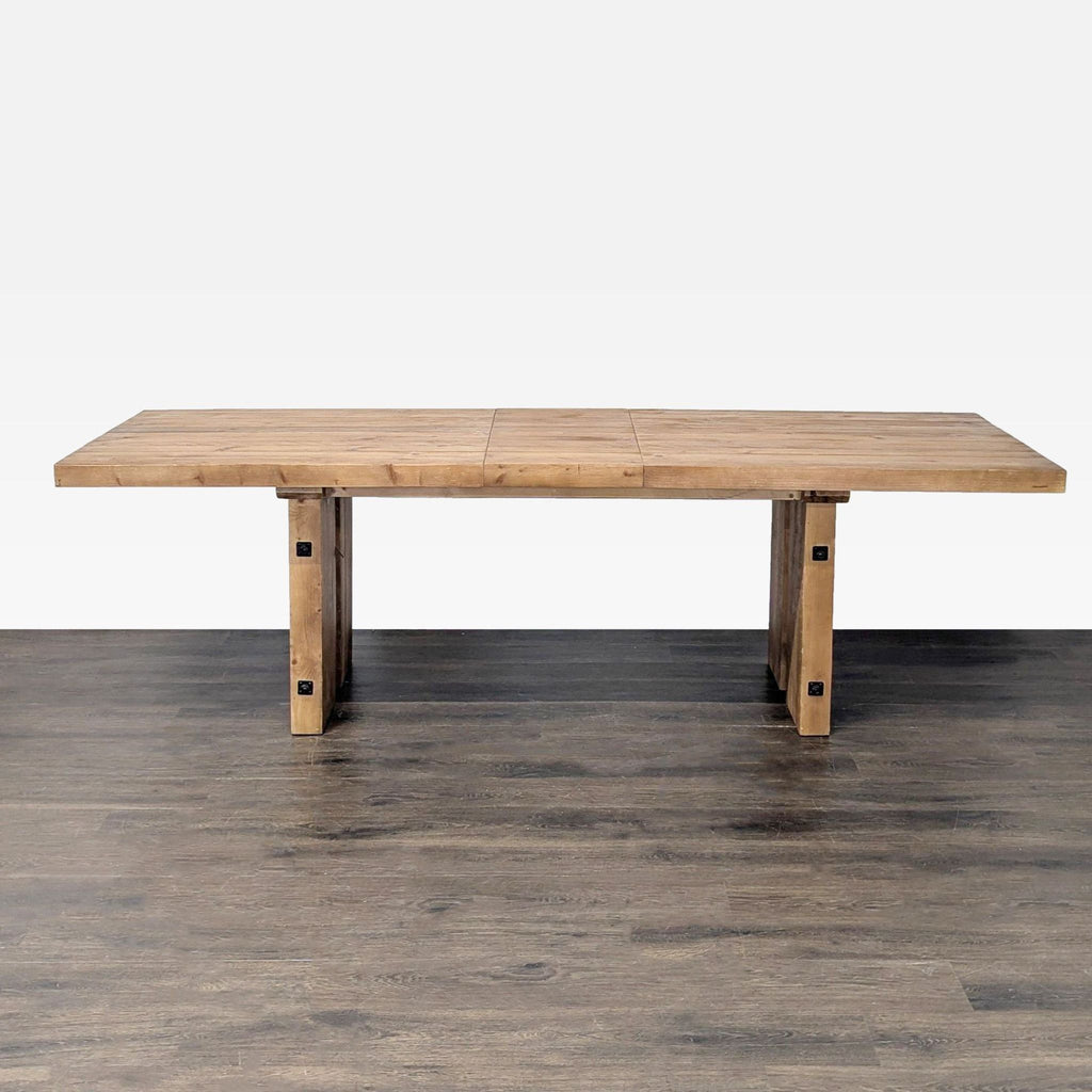 Pottery Barn eco-friendly wood table with metal details, pictured at 100-inch length for eight seats.