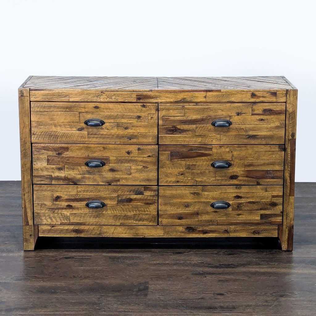 Magnussen rustic dresser with six drawers, black metal handles, and warm wood finish for ample bedroom storage.  