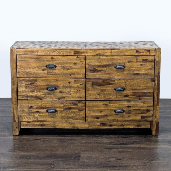 Magnussen rustic dresser with six drawers, black metal handles, and warm wood finish for ample bedroom storage.  