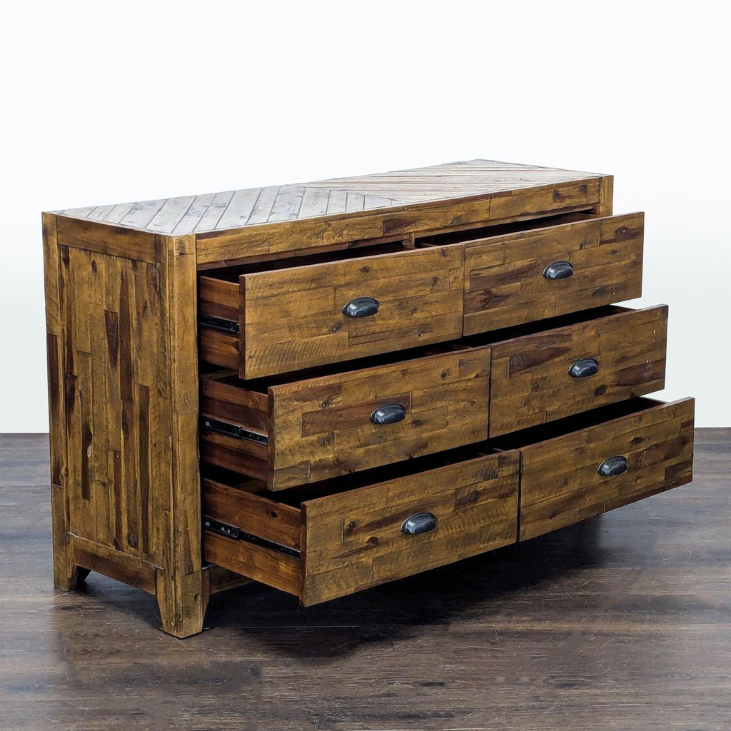 Wooden Magnussen dresser featuring six spacious drawers and black metal handles, combining rustic and industrial style.  