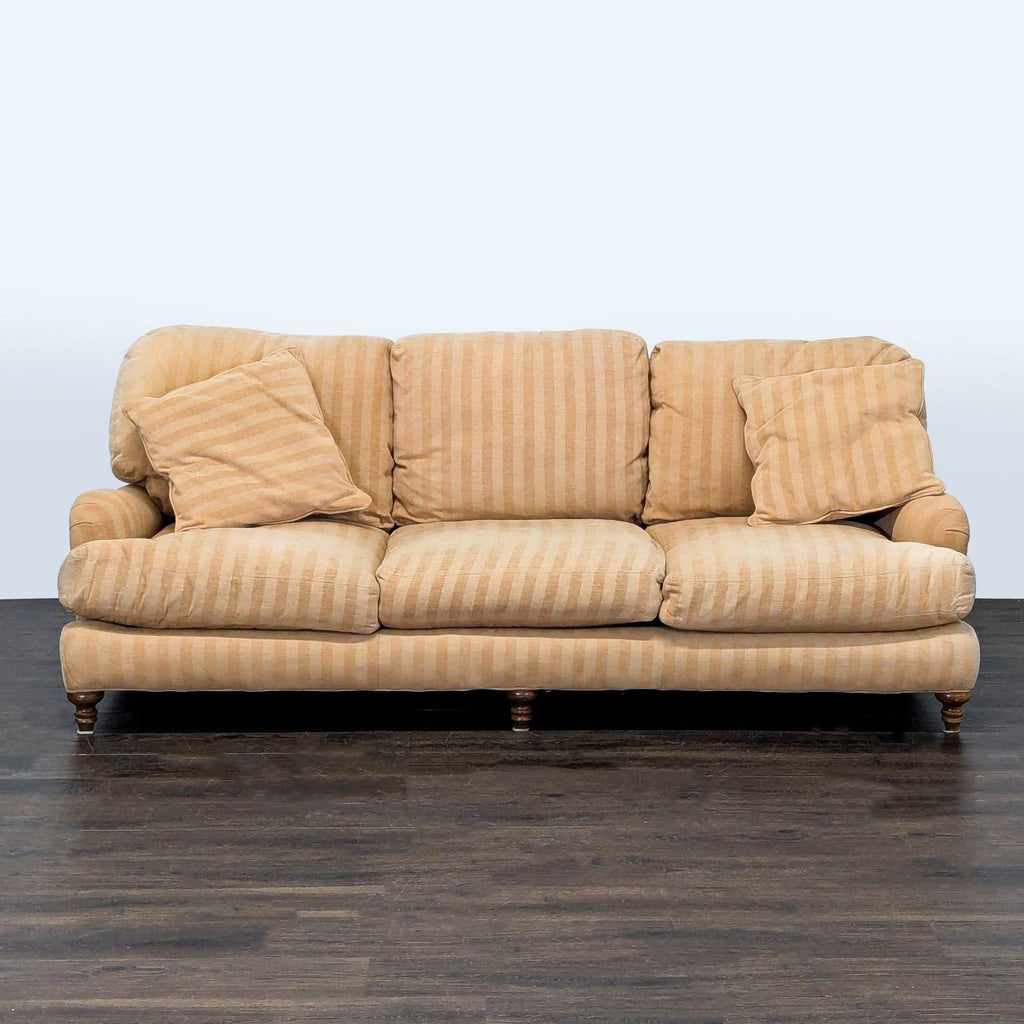 Crate & Barrel 3-seat sofa in beige striped fabric, with three back cushions and two side pillows.