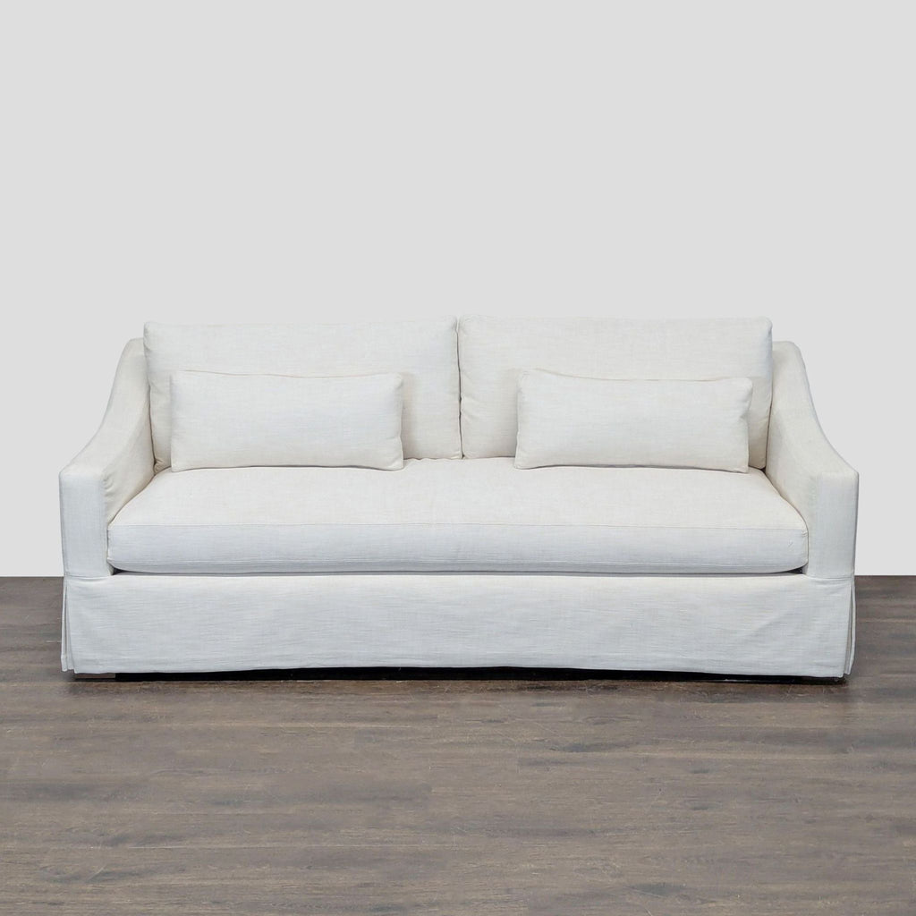 Restoration Hardware white loveseat with removable slipcover, two cushions, and lumbar pillows, skirted base design.  