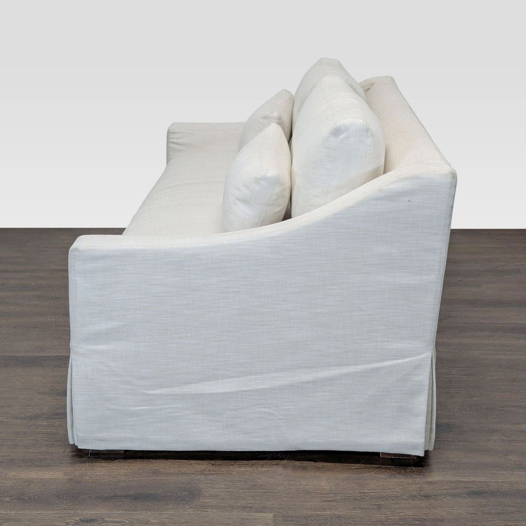 Elegant white slipcovered loveseat by Restoration Hardware; includes seat/back cushions and lumbar support pillows.