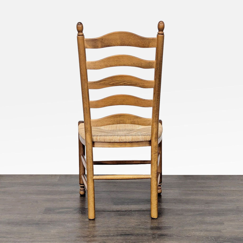 Italian-made dining chair from Pottery Barn featuring a rush seat and classic wooden design.  