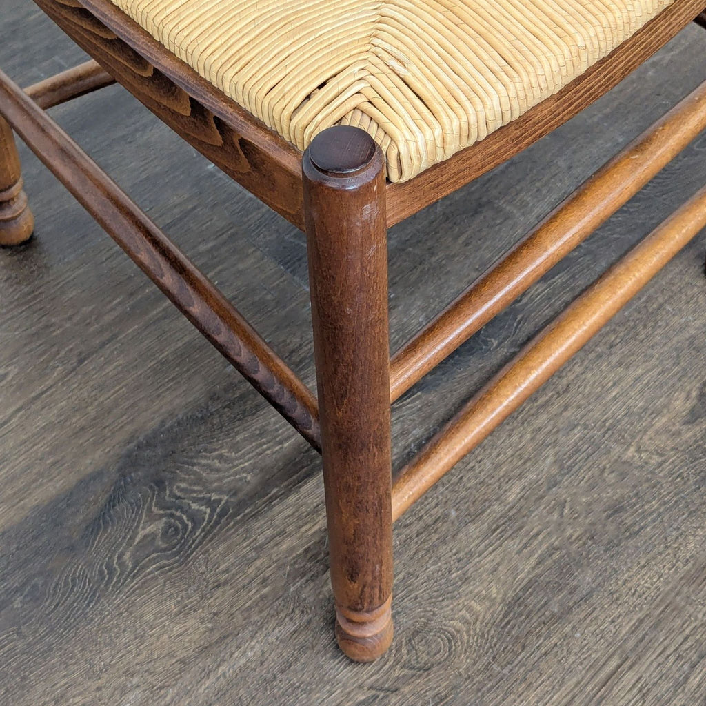 Dining chair with rush seat, crafted in Italy, presented by Pottery Barn for dining room use.