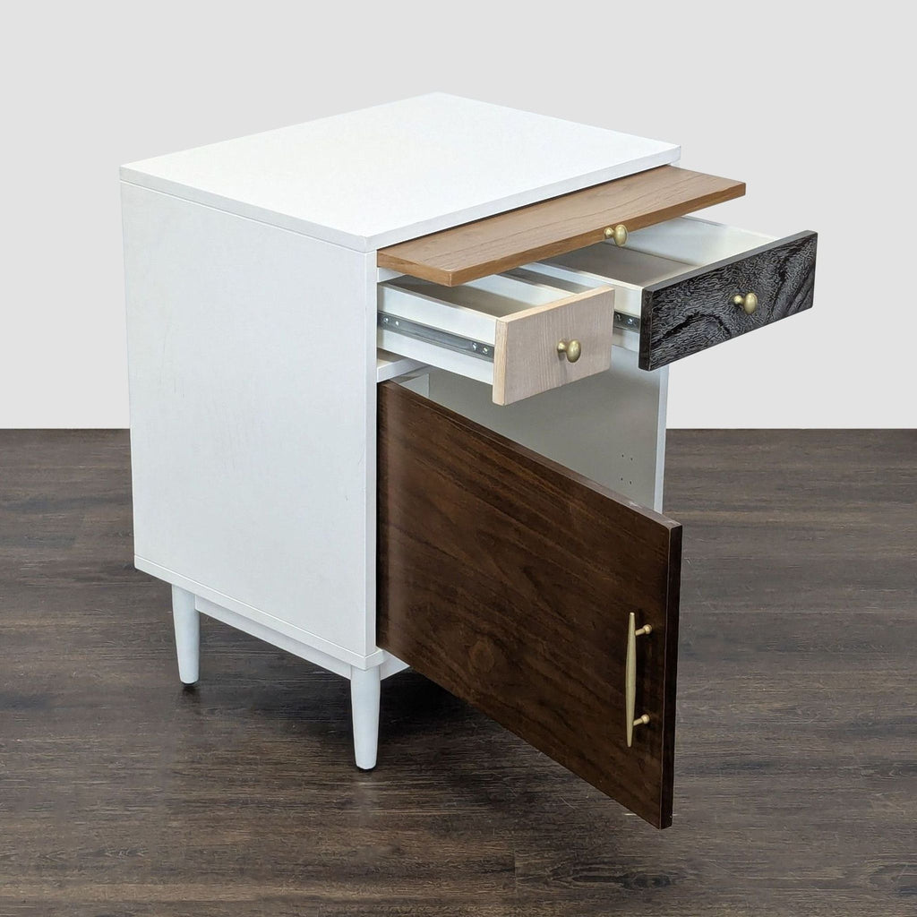 Compact West Elm end table with upper drawers, a pull-out tray table, and a bottom cabinet with shelving.