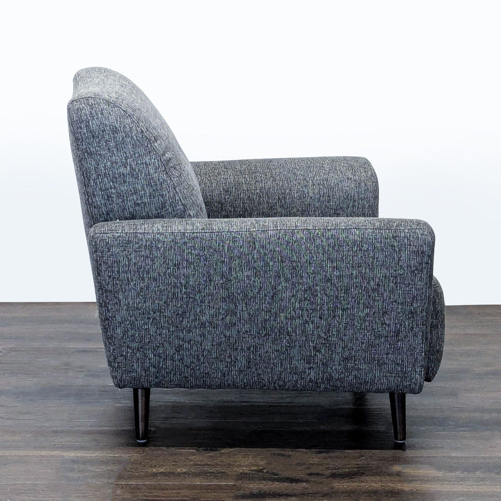 Comfortable grey upholstered lounge chair by Jason Furniture, perfect for reading or unwinding at home.