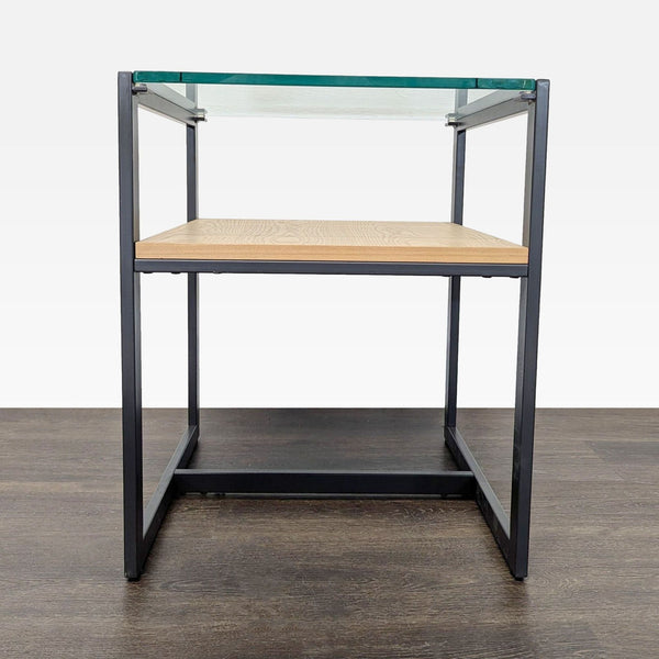 Modern end table with a clear glass top and a natural wood shelf underneath.  