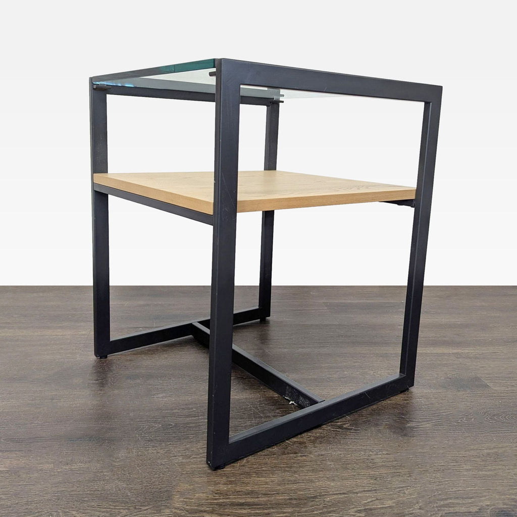 Contemporary end table featuring a wooden lower shelf and a transparent glass surface.  