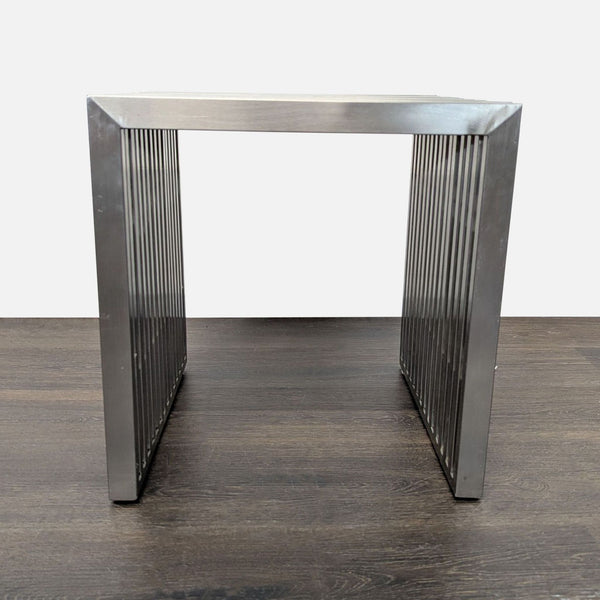 1. Sturdy metal side table with a unique slatted design, shown from a front view, ideal for modern spaces.