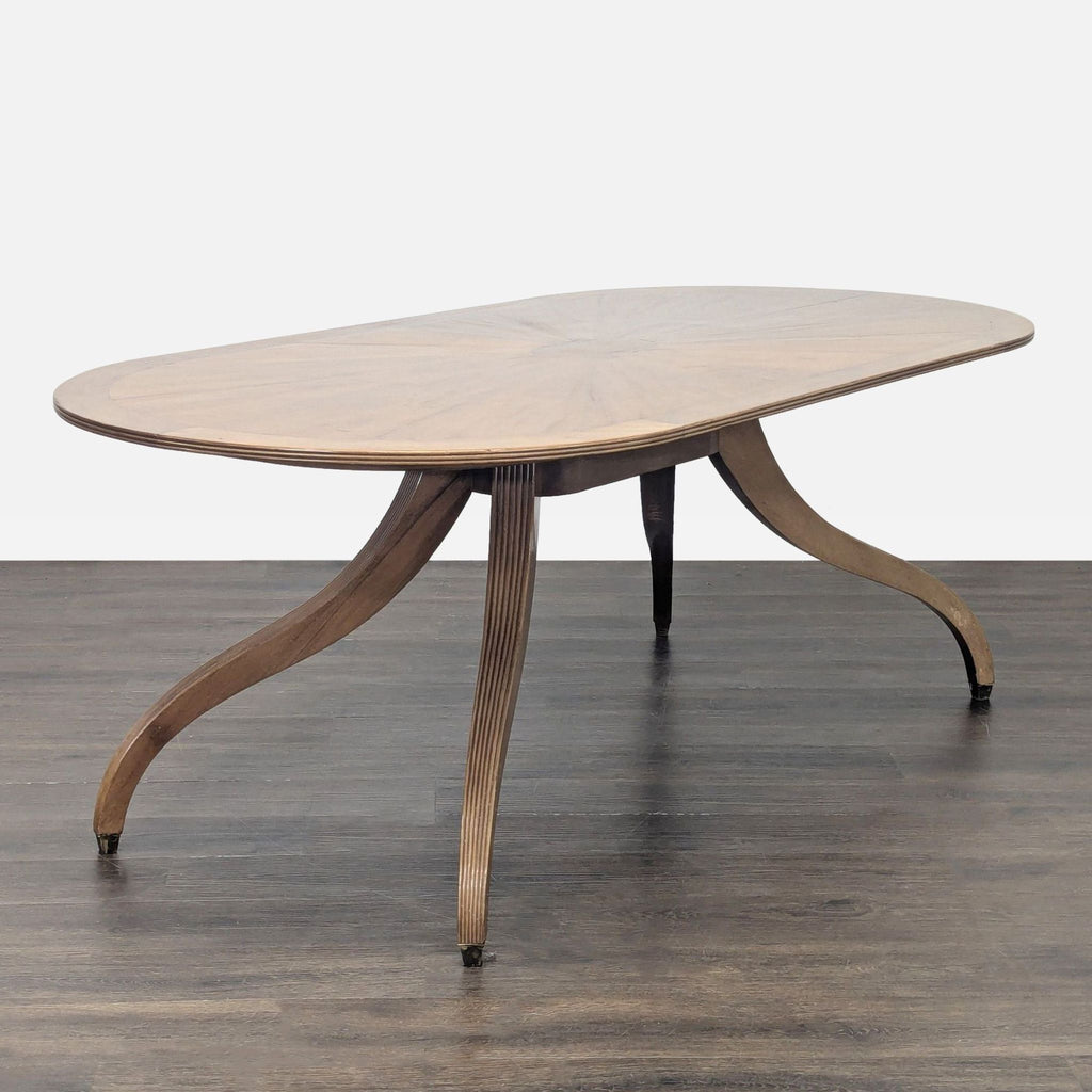 Rose Tarlow dining table featuring spider legs and classic Regency design details.  