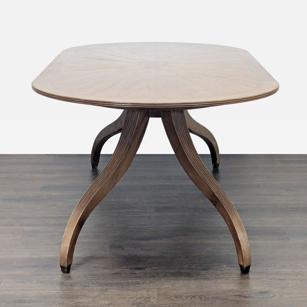 Elegant double pedestal dining table by Rose Tarlow with reeded apron and spider-leg supports.
