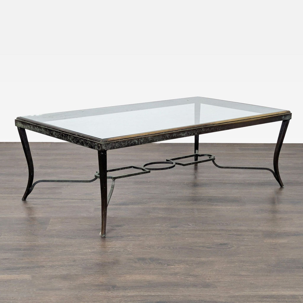 Carole Gratale Inc. designer coffee table featuring gilded edging and an open geometric iron base.