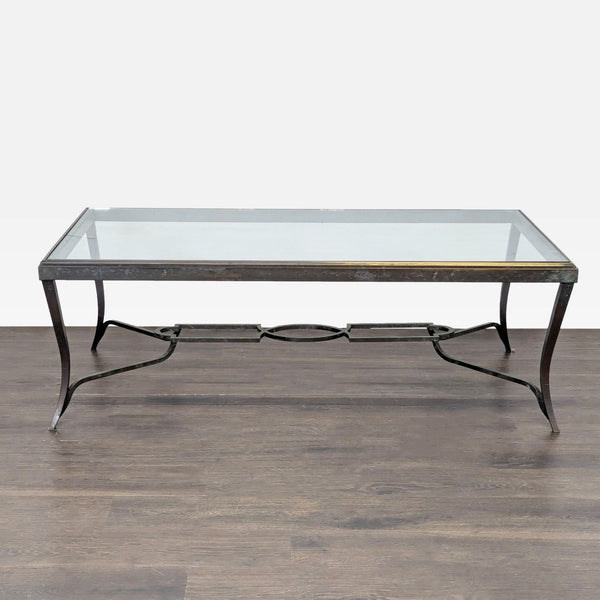 Hollywood Regency coffee table by Carole Gratale with a glass top and patinaed iron cabriole legs.
