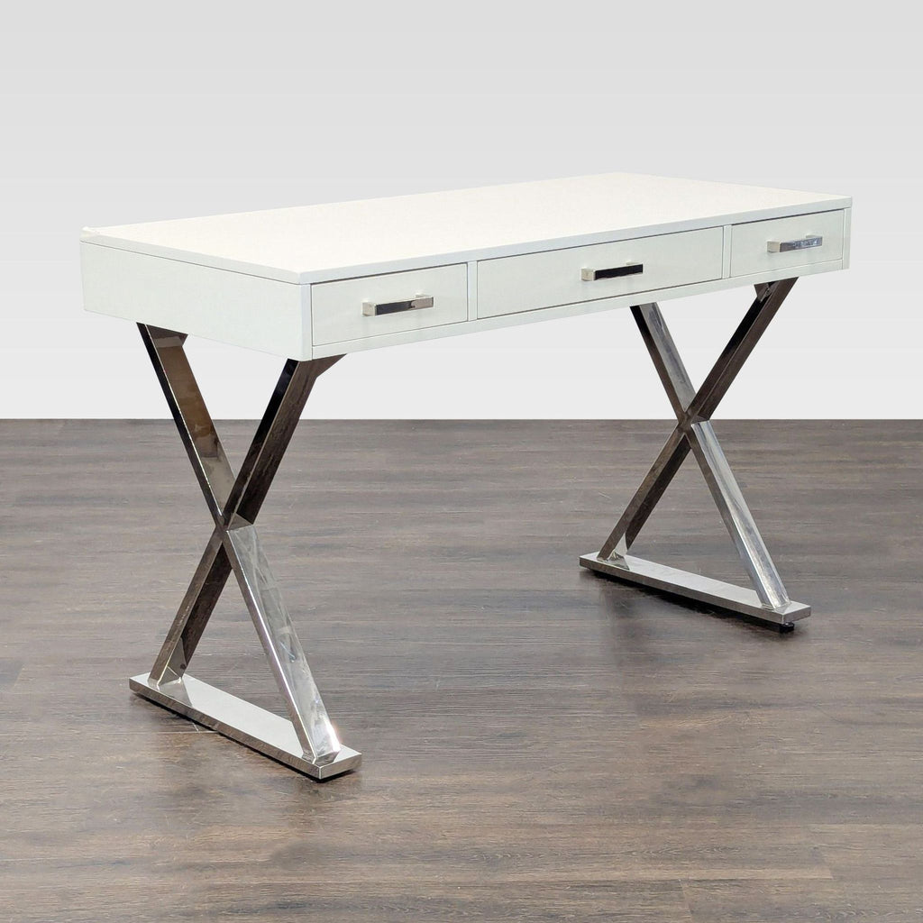 Pottery Barn desk in clean white finish, chrome legs, and three large drawers for organized workspace.