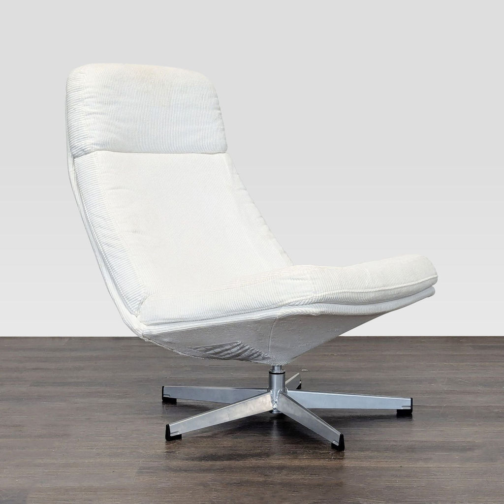 Modern Ikea lounge chair in white upholstery and silver metal base, perfect for reading or unwinding at home.