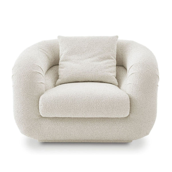 Cream bouclé Castlery lounge chair with plush cushion, rounded shape, and modern design for cozy living spaces.