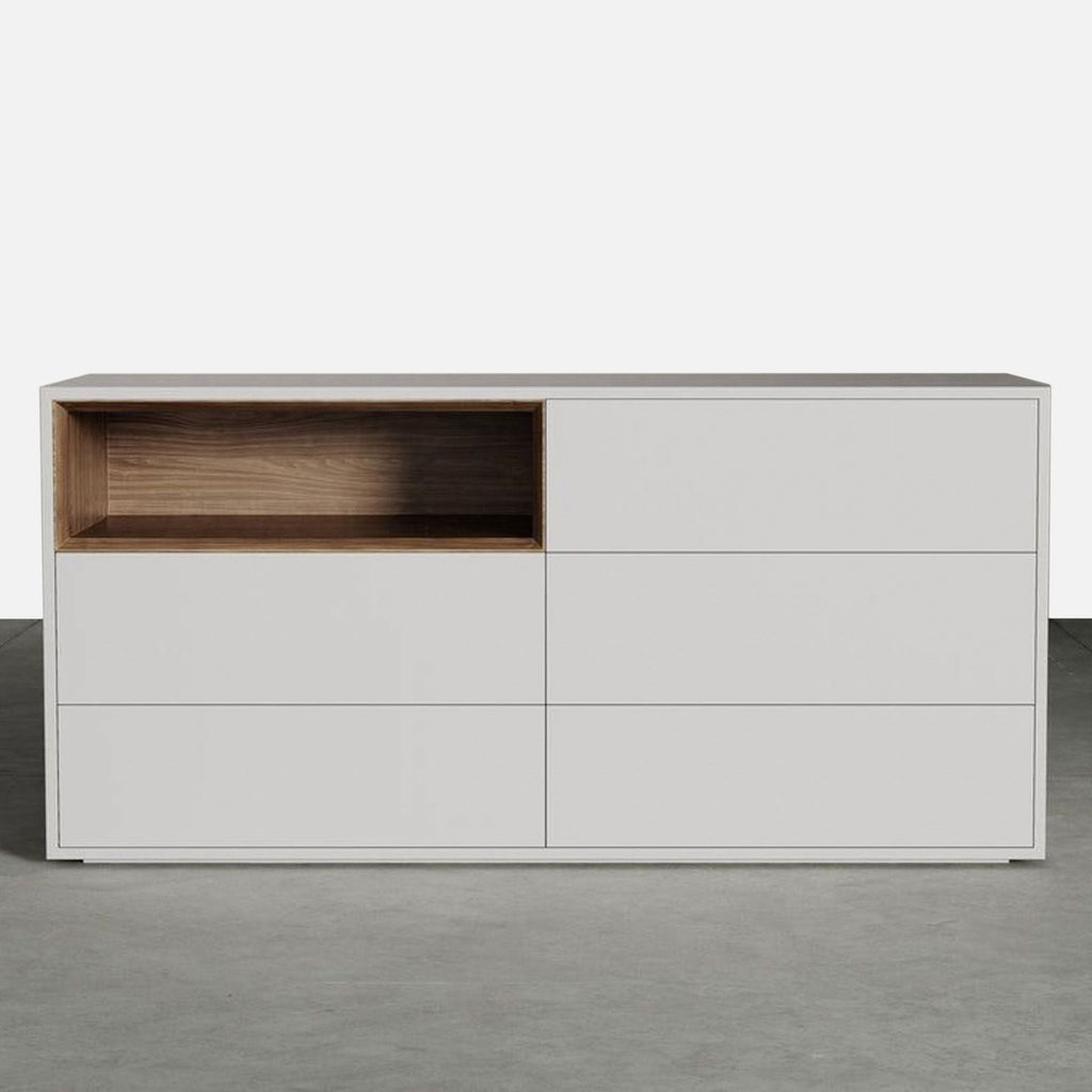 Modern Modloft dresser with a matte white finish, wood accent shelf, and six large drawers for storage.
