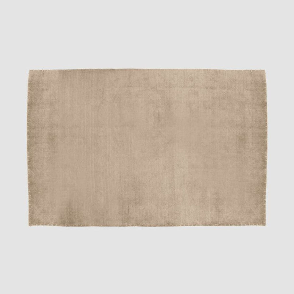 Handwoven wool and silk rug by The Citizenry featuring a soft neutral tone and simple, versatile design.