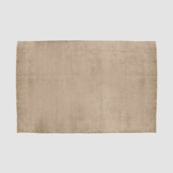 Handwoven wool and silk rug by The Citizenry featuring a soft neutral tone and simple, versatile design.