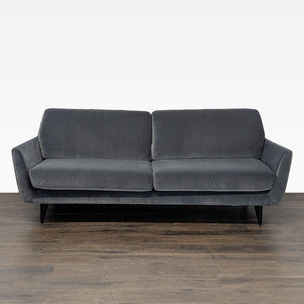 Sits For Crate And Barrel 3-seat sofa with dark gray fabric, plush cushions, and sleek black legs.