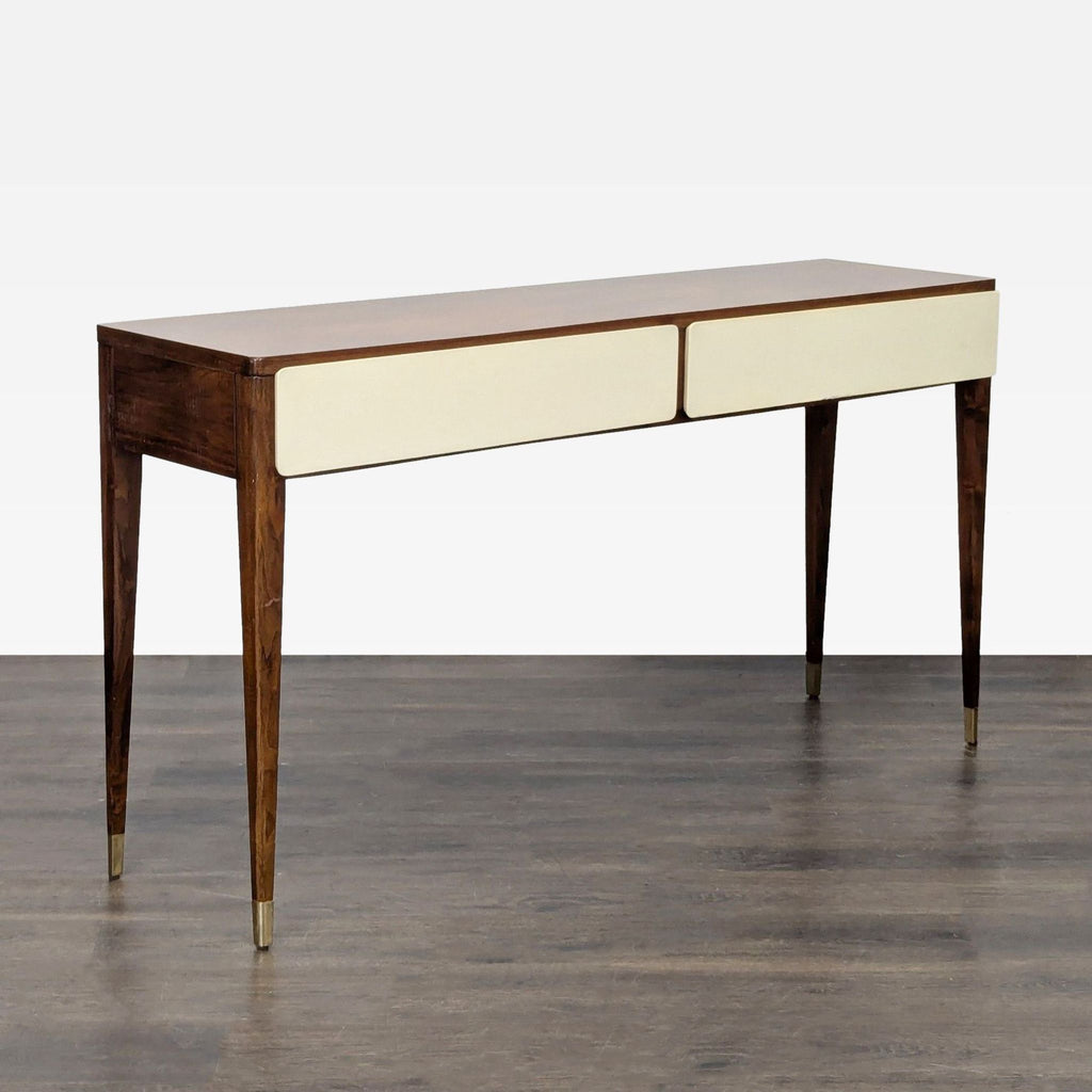 Modern console table with two storage drawers, wood and white design, and brass-tone accents on slim legs.