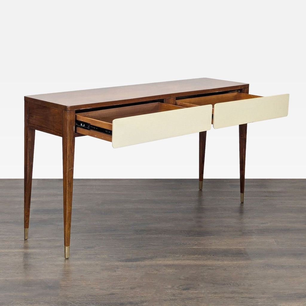 Side table featuring a wooden frame, white drawer fronts, and slender legs with metallic tips for a modern touch.