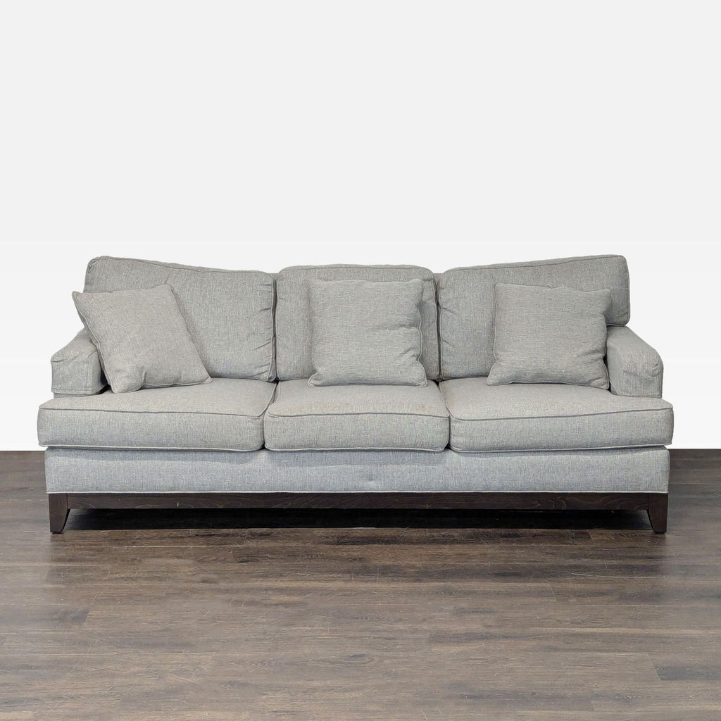 Ethan Allen 3-seat sofa in modern gray fabric with four matching cushions and sturdy wooden base.  