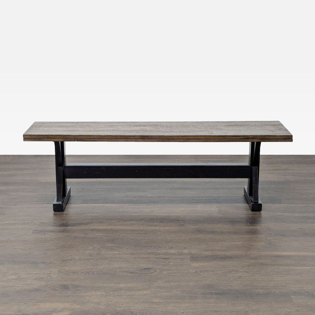 Wayfair's two-tone bench featuring a rustic planked top and distinctive X-shaped trestle base.