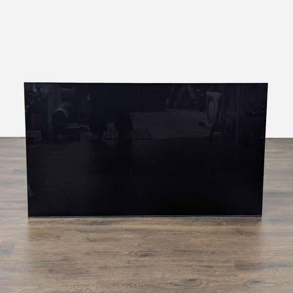 Sony 55-inch Smart LED TV with clear screen and slight exterior wear, remote and stand not included.  