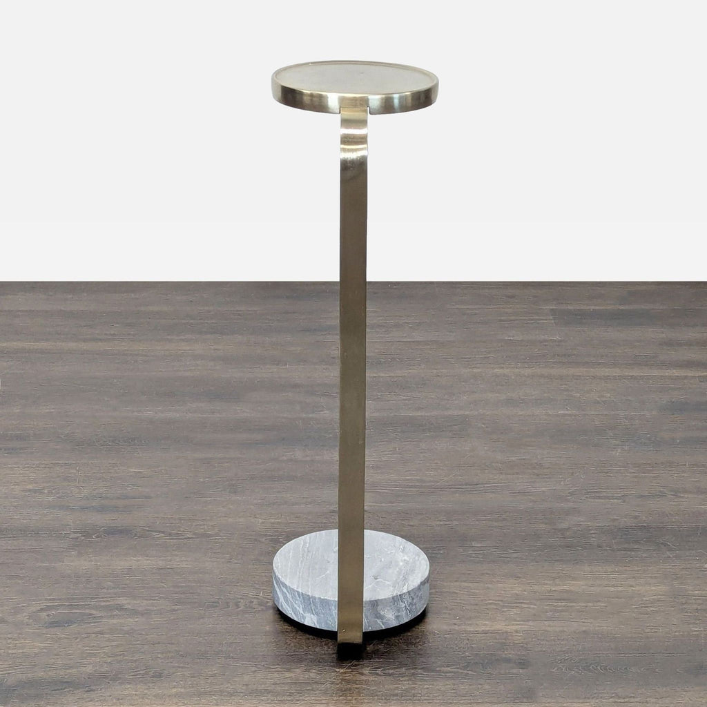 Elegant brass-framed marble base table by West Elm, ideal as side or console furniture.