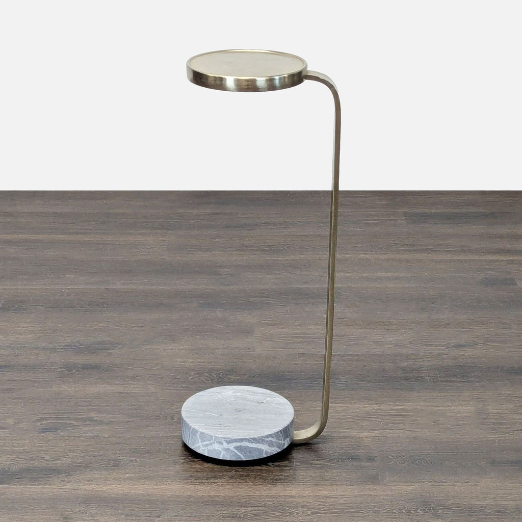 West Elm console table featuring a brass finished frame and sturdy marble base.  