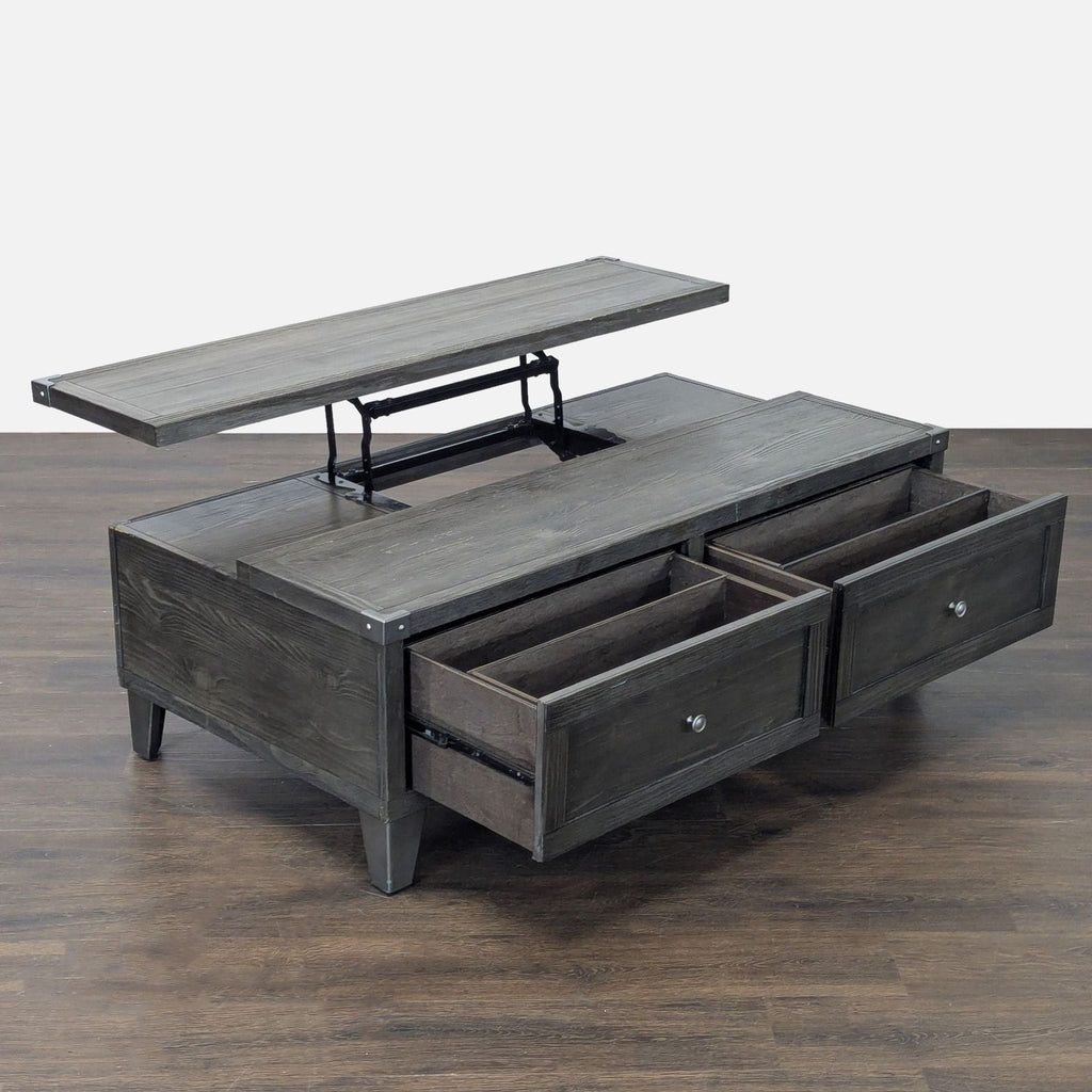 Modern Ashley Furniture coffee table with spring-loaded lift-top, two drawers, and removable storage trays.