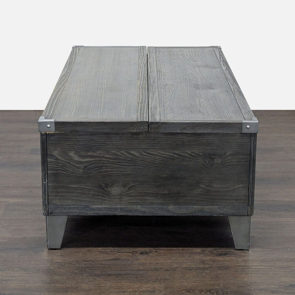 Lift-top coffee table by Ashley in rustic dark gray finish, featuring metal legs, drawers, and storage trays.