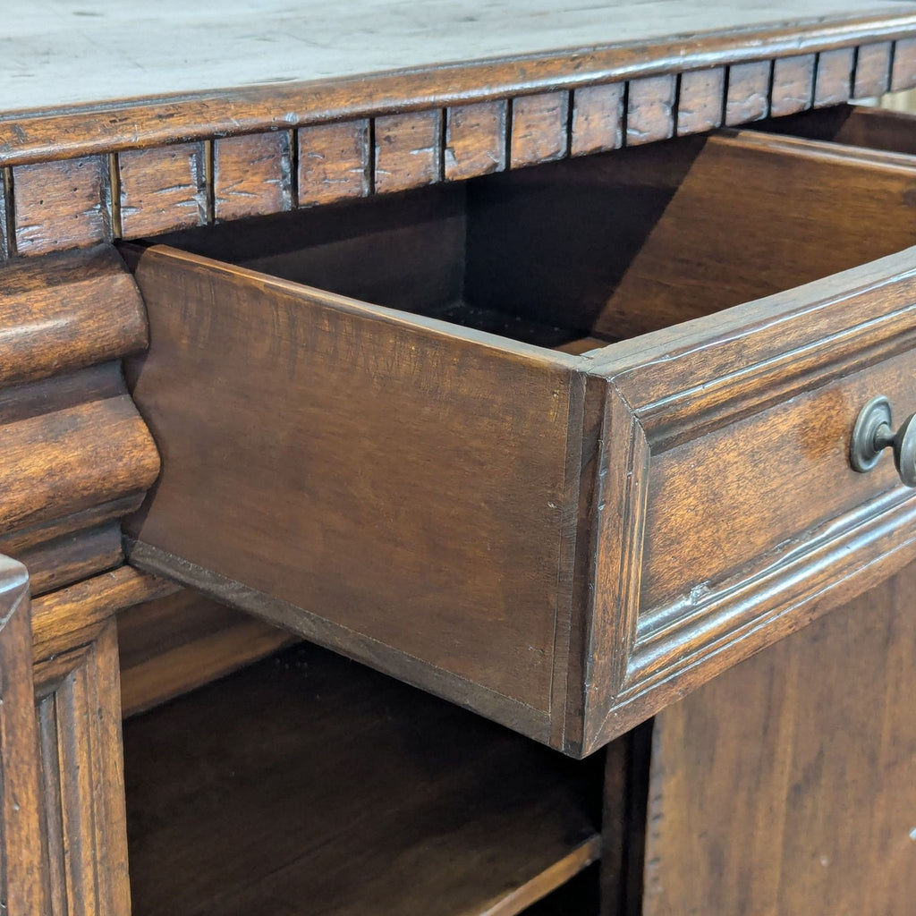 Formations walnut credenza with five drawers, two doors, fixed shelf, and ornamental dental molding.