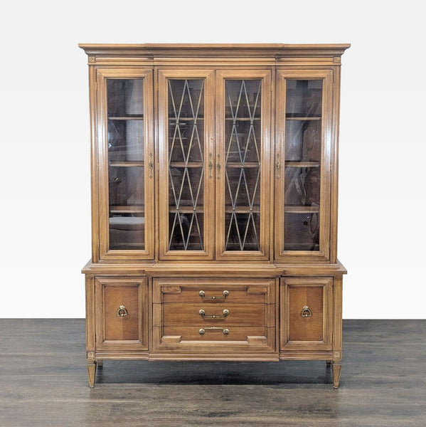 Mid-century Thomasville hutch with leaded glass upper doors, shelving, and lower storage cabinets.