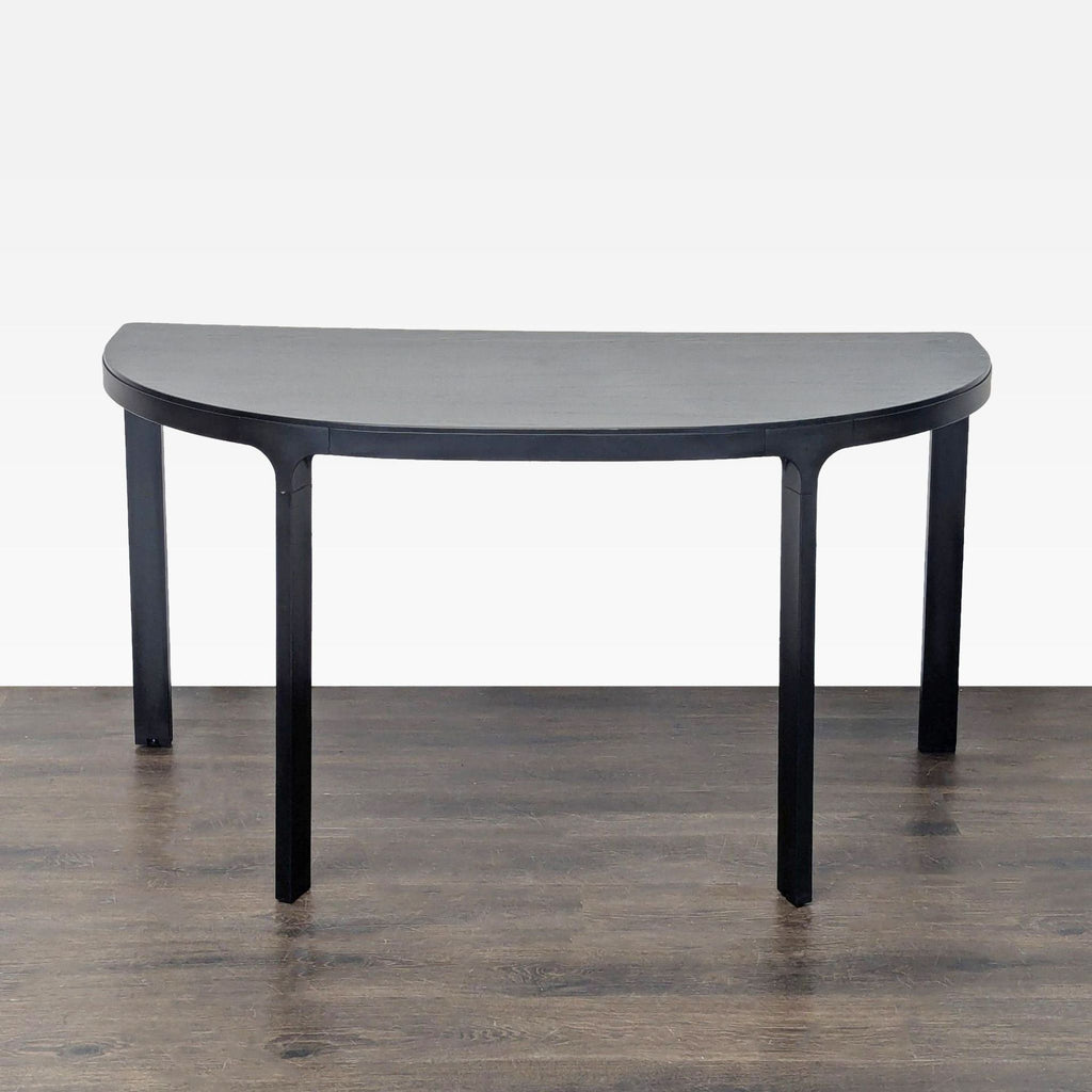 Modern Ikea console table in black with a half-moon style, fitting neatly in entryways or living spaces.