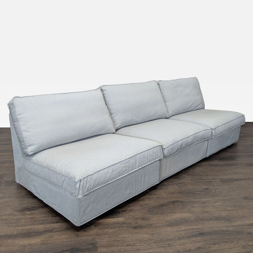Ikea sectional sofa in a neutral gray shade, built for comfort and everyday living room use.