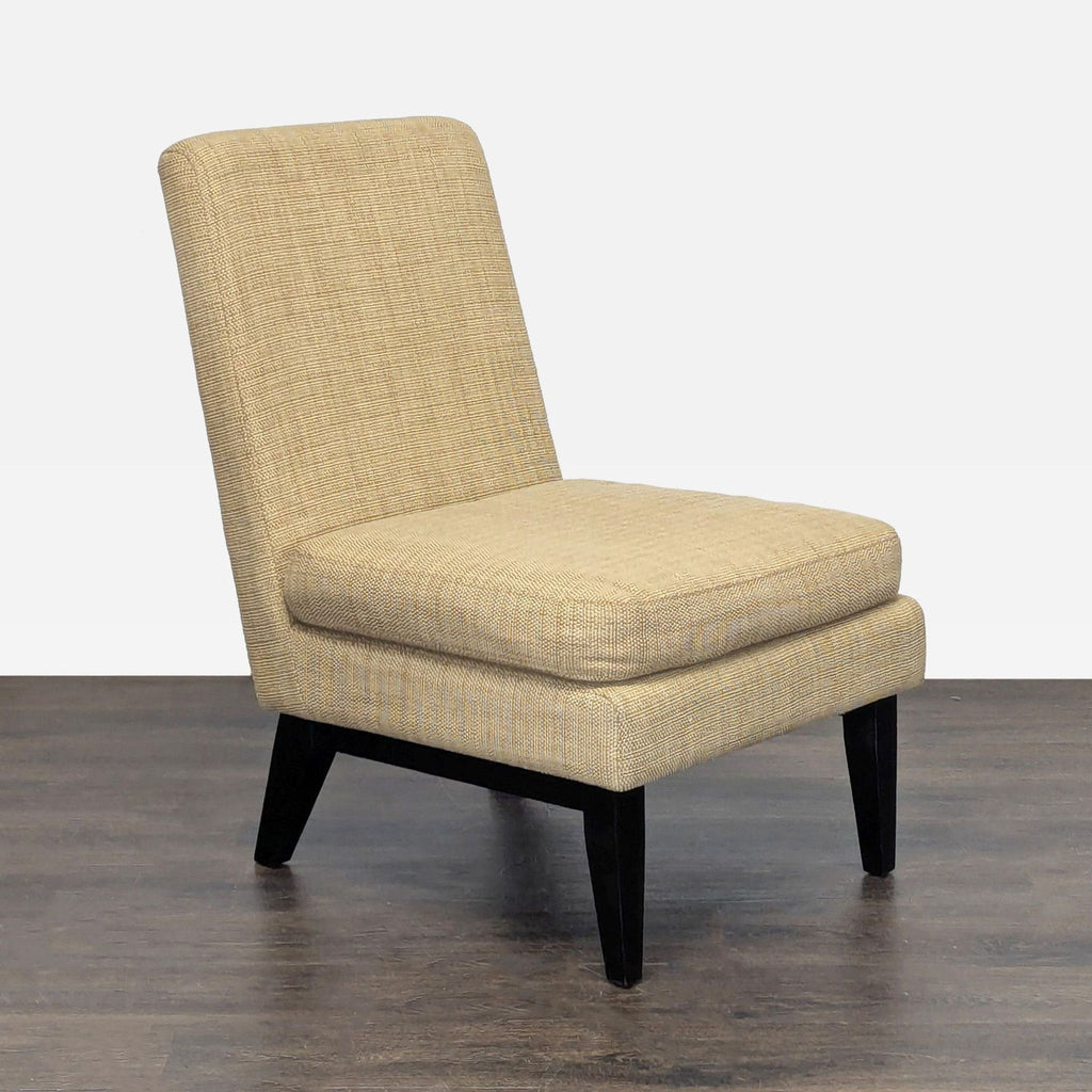 Modern tan lounge chair by West Elm featuring textured upholstery and dark wood legs, ideal for small spaces.