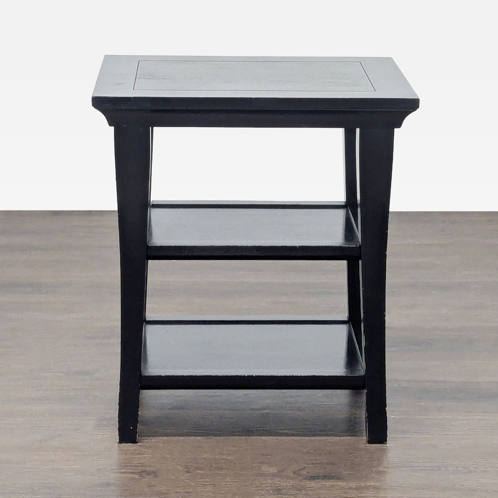 Two-shelf wood end table by Pottery Barn with a simple, functional design.