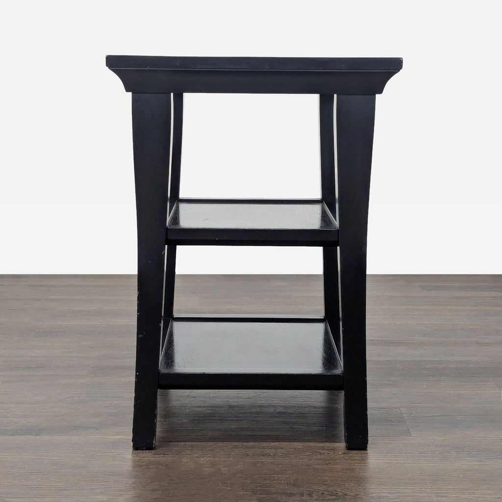 Pottery Barn end table featuring a wooden frame and two spacious shelves for storage.